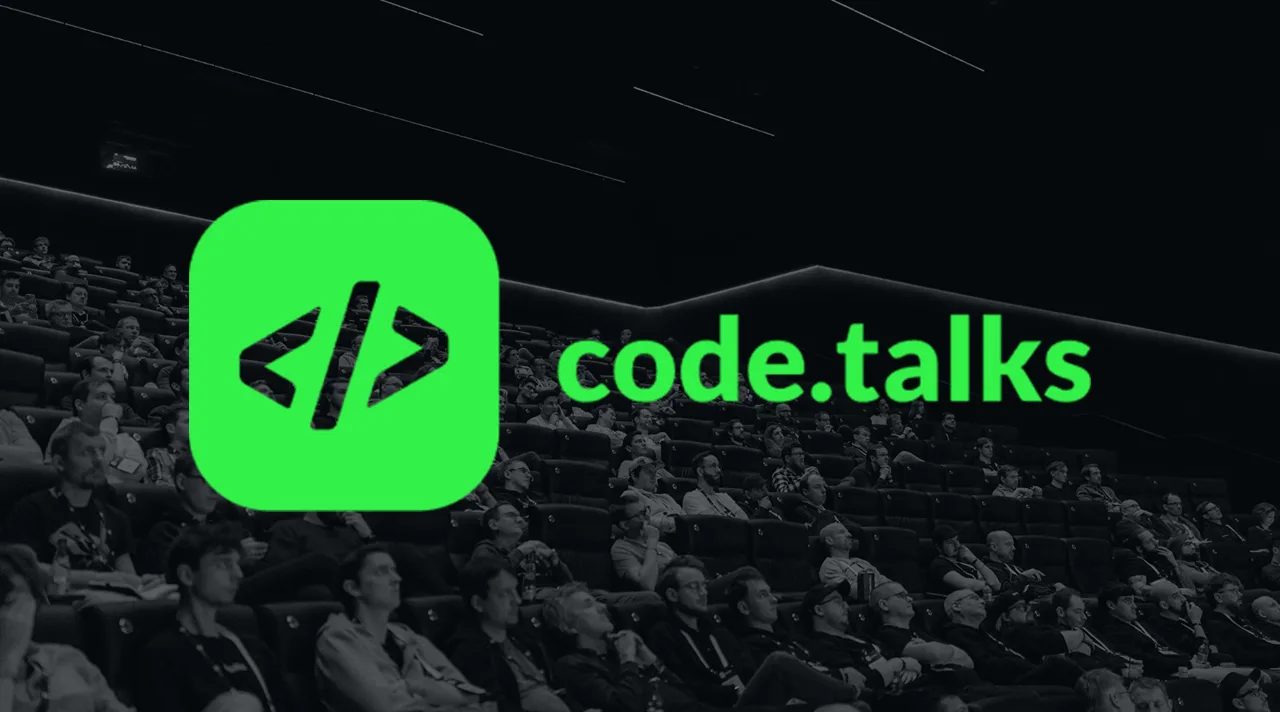Logo der Konferenz code.talks vor Publikum